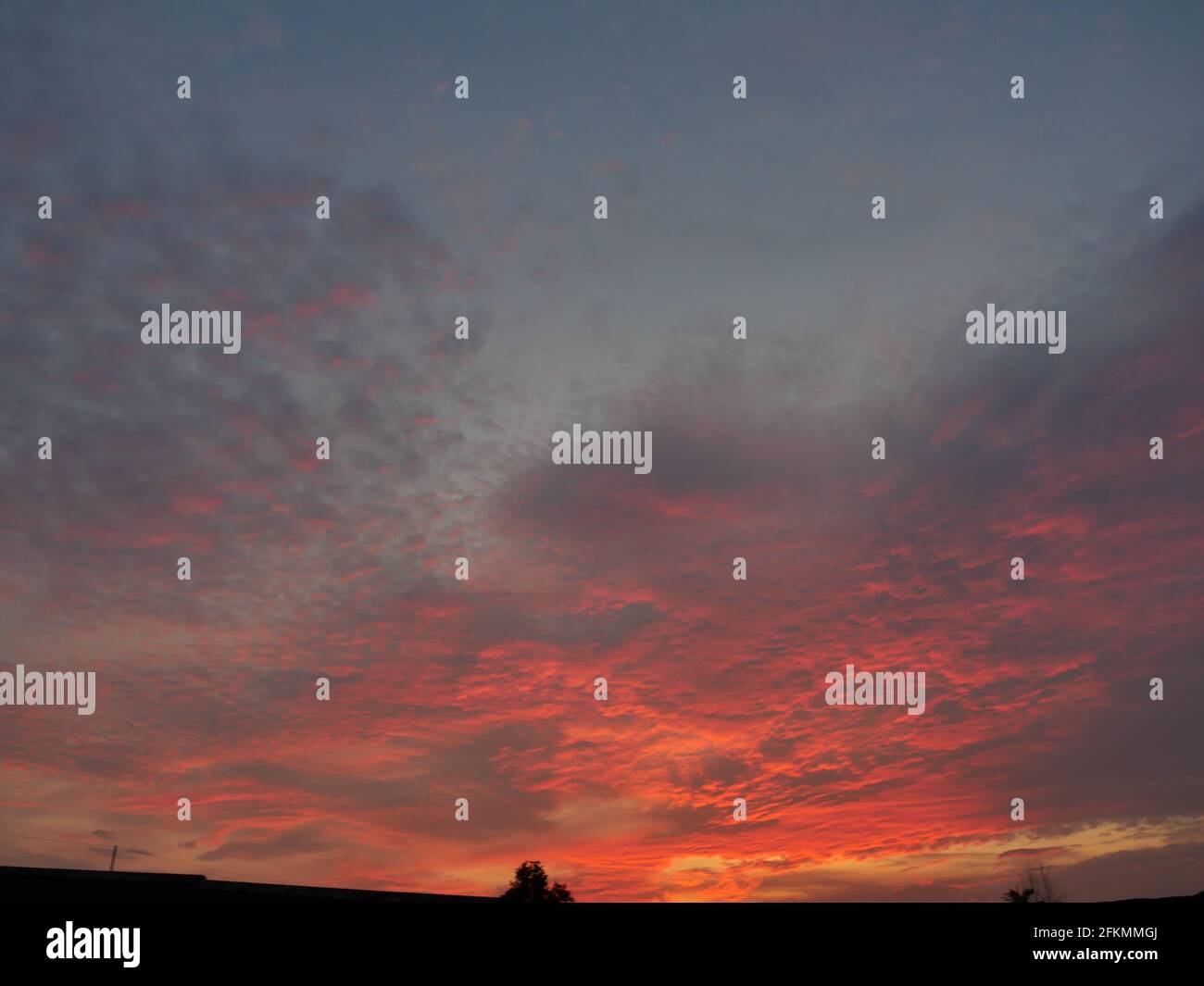 Dark cloud and blue sky in magic hour at sunset, The horizon began to turn orange with purple and pink cloud at night, Dramatic cloudscape area Stock Photo