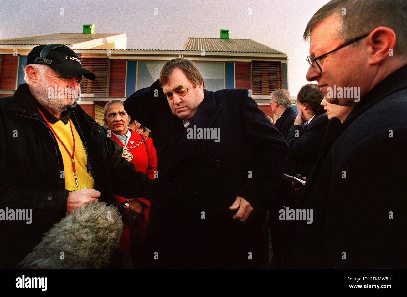John Prescott Deputy Prime Minister, December 2000emerging from one of the new finished apartments built on the Greenwich Millenium Village. In total, around 3000 new homes are to be built onto the Greenwich Peninsula. Stock Photo