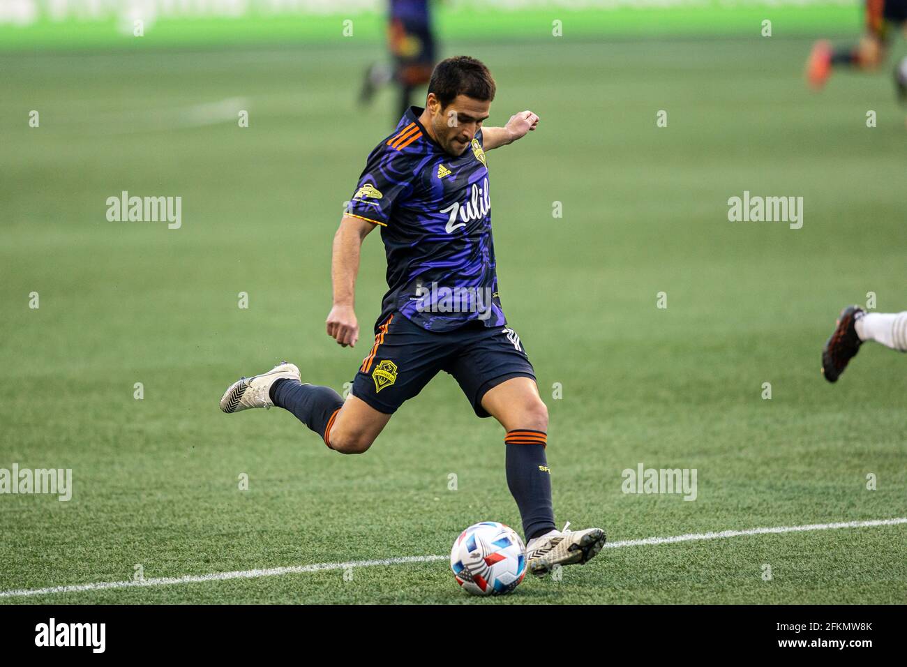 Seattle Sounders midfielder Nicolas Lodeiro (10) kicks the ball during the second half of an MLS match against the LA Galaxyat Lumen Field, Tuesday, M Stock Photo