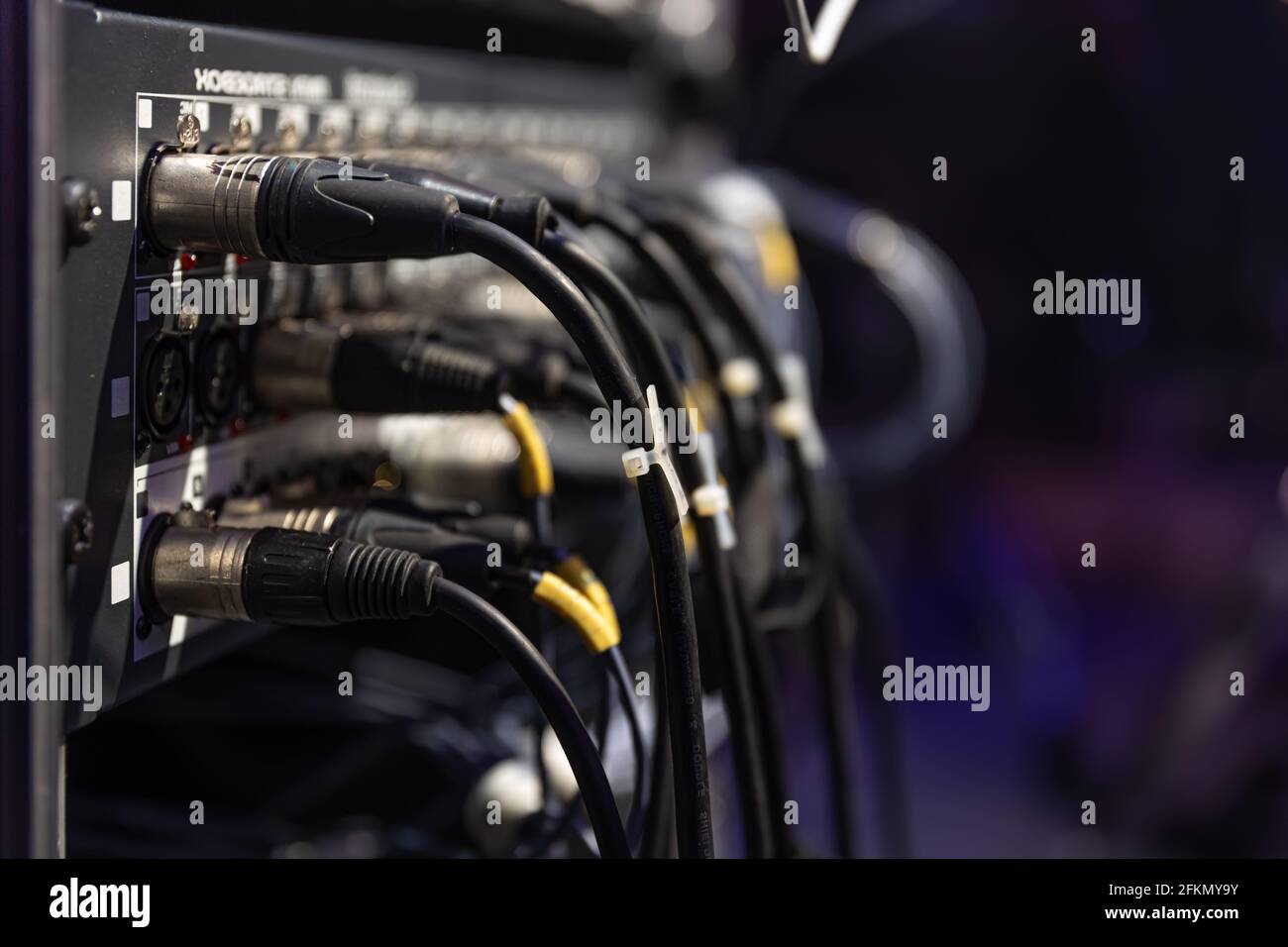 Audio snake and stage box with xlr cables and jacks at a live show