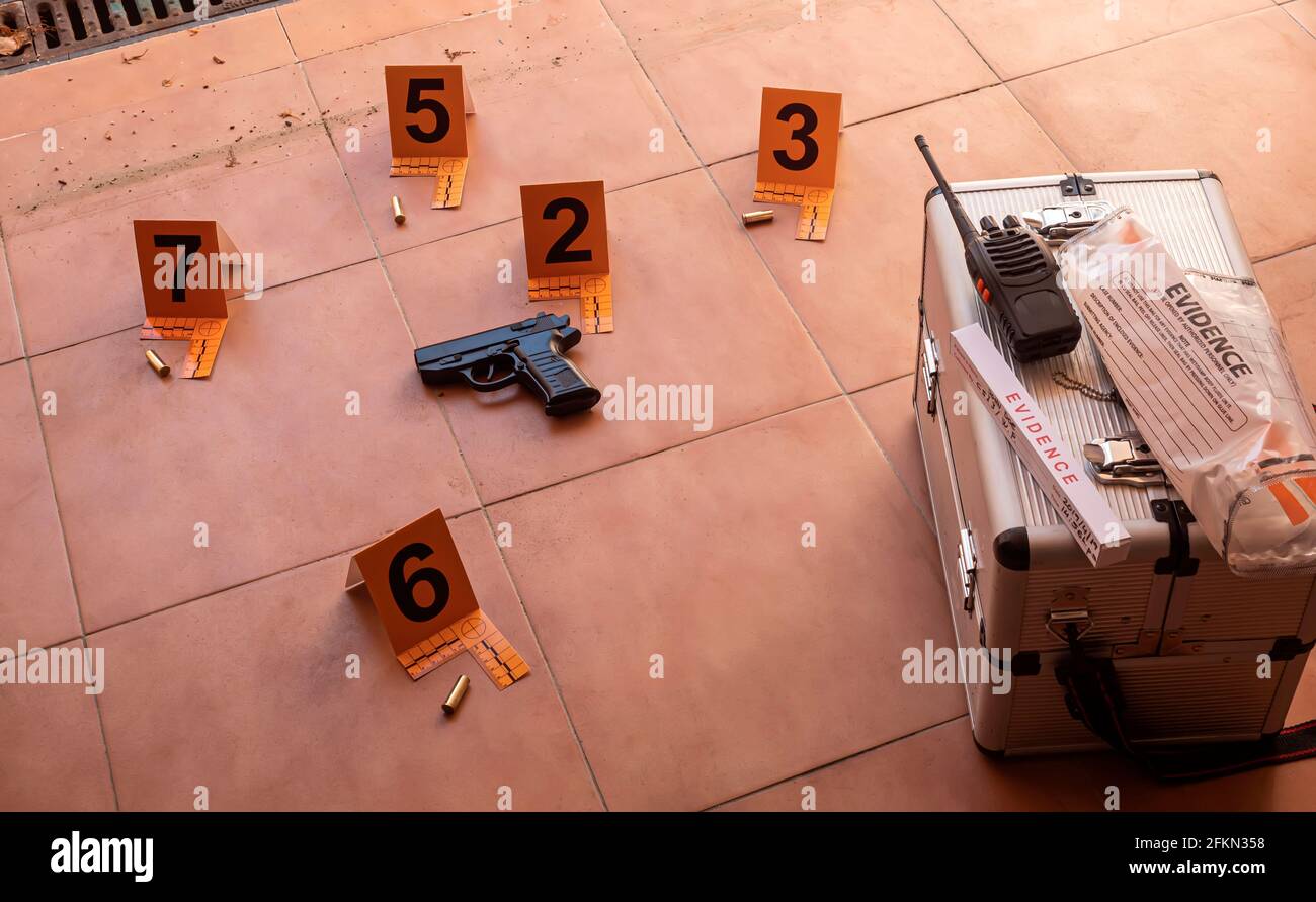 Several bullet shell casings marked at crime scene, concept image Stock Photo