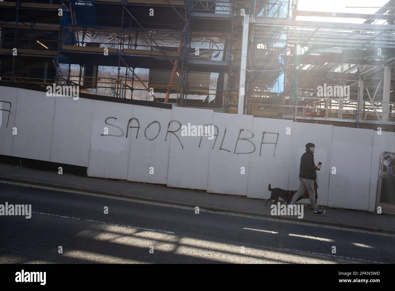 'Gon Yersel Nicola' and 'Saor Alba' graffiti on a building site in Maryhill, Glasgow, Scotland. Stock Photo