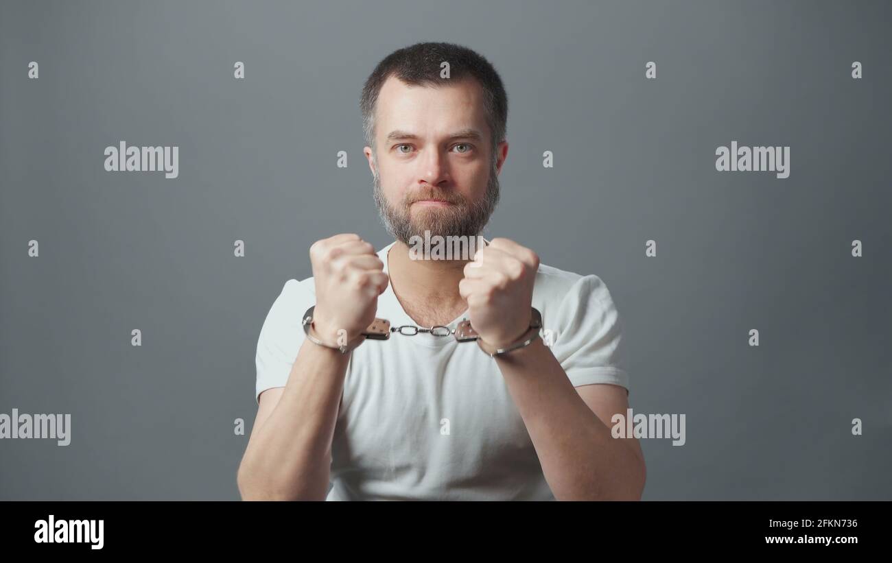 Photo of the arrested man with handcuffs Stock Photo - Alamy