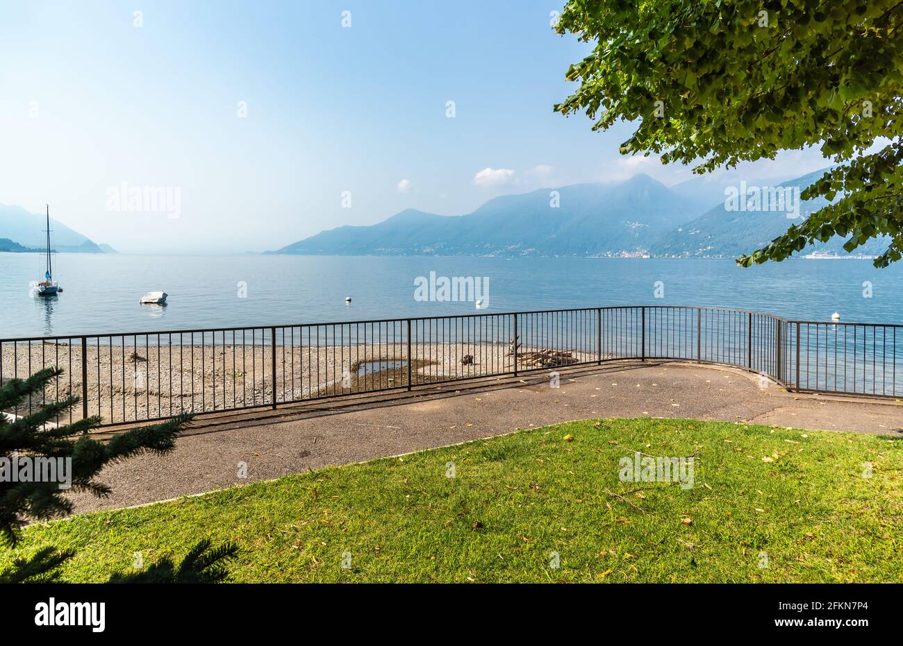 Landscape of Lake Maggiore in a sunny day from the Colmegna lakeside, municipality of Luino, Italy Stock Photo