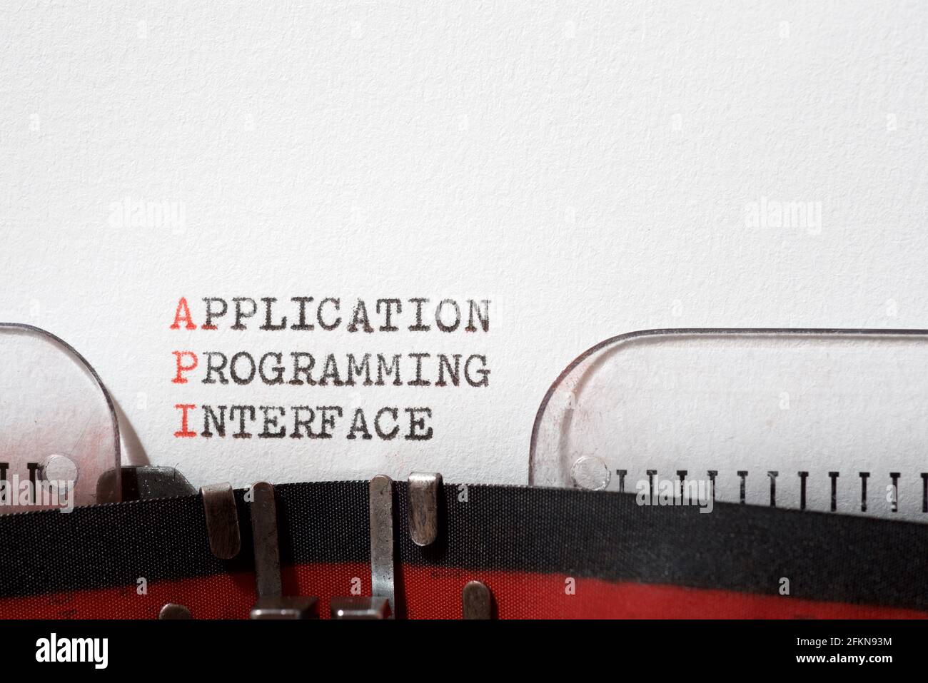 Application programming interface phrase written with a typewriter. Stock Photo