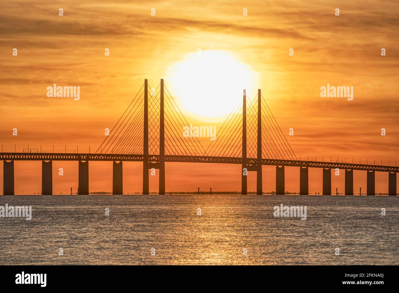 Oresund Bridge sunset in the Baltic sea, detail of the central pylons. The link between Copenhagen and Malmo was built to close a cultural gap Stock Photo
