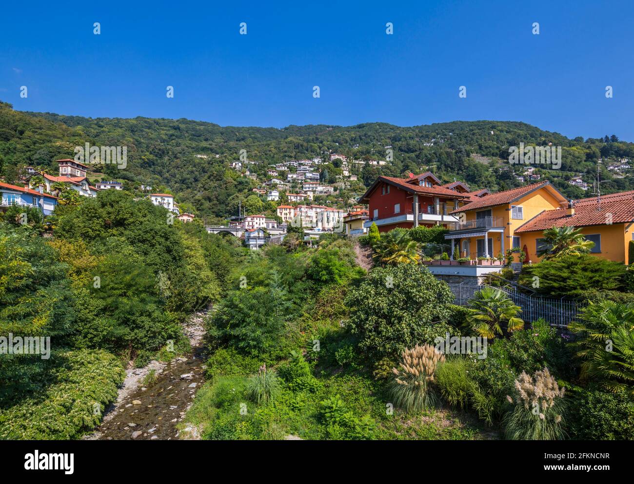 View of lakeside town from harbour at Cannero Riviera, Lake Maggiore, Piedmont, Italy, Europe Stock Photo