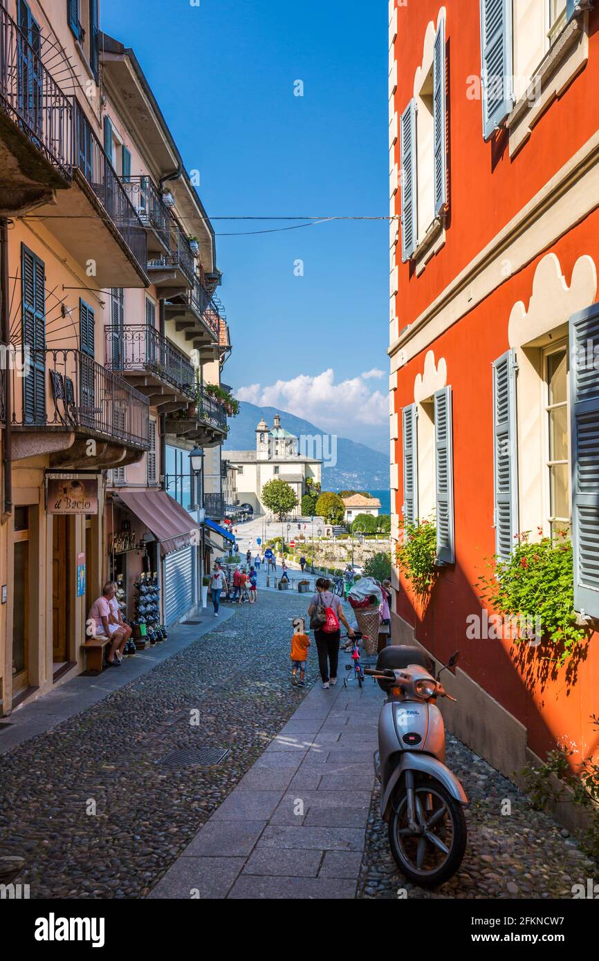 View of cobbled street and Santuario della SS Pietà Church in Cannobio, Lake Maggiore, Piedmont, Italy, Europe Stock Photo