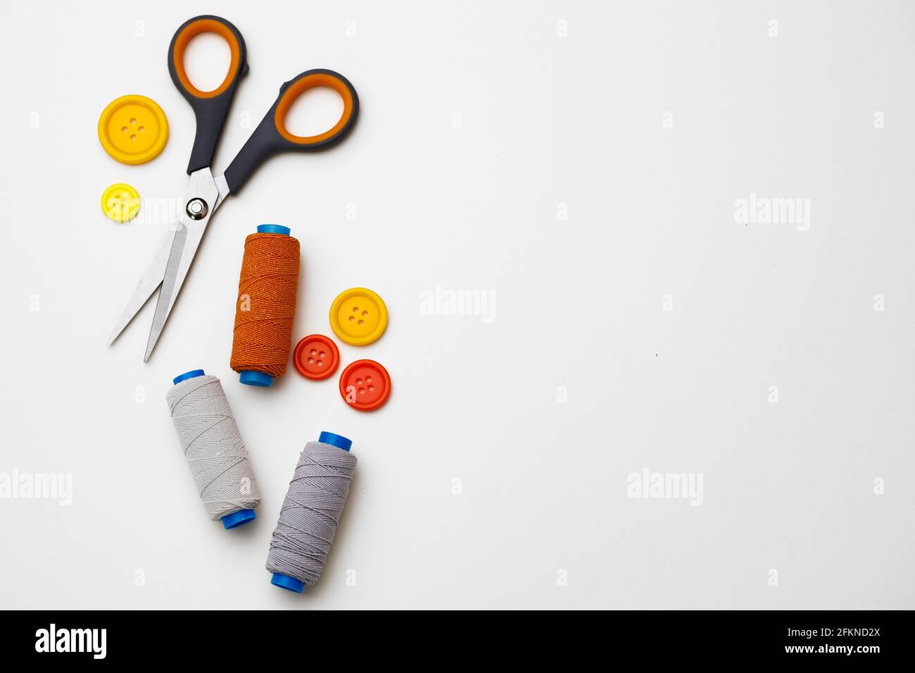 Various sewing accessories isolated on white background Stock Photo - Alamy