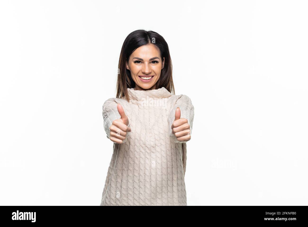 Portrait of beautiful woman with thumbs up sign on white background ...