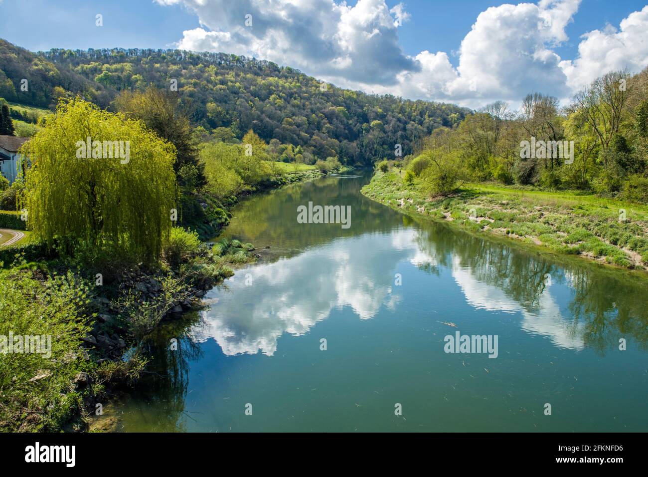 A placid River Wye photographed down river from the Brockweir Bridge in the Wye Valley AONB Stock Photo