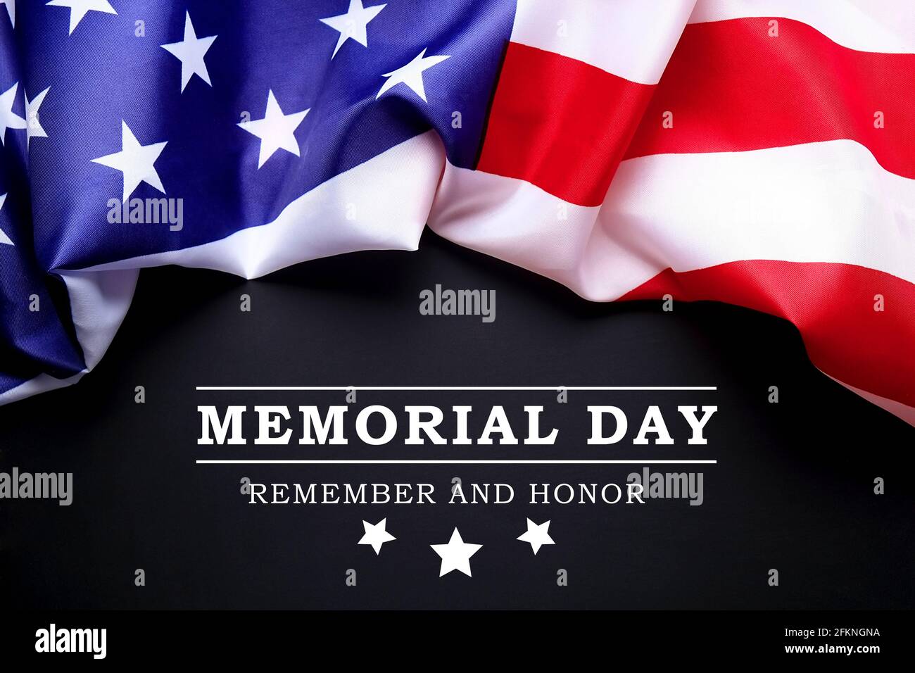 Memorial day weekend text written black chalkboard background with USA flag. United States of America stars & stripes patriot veteran remembrance symb Stock Photo