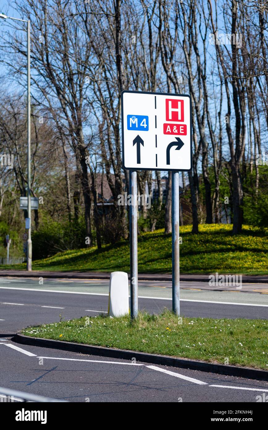 Road sign directing traffic to hospital, casualty, A&E and M4 Stock Photo