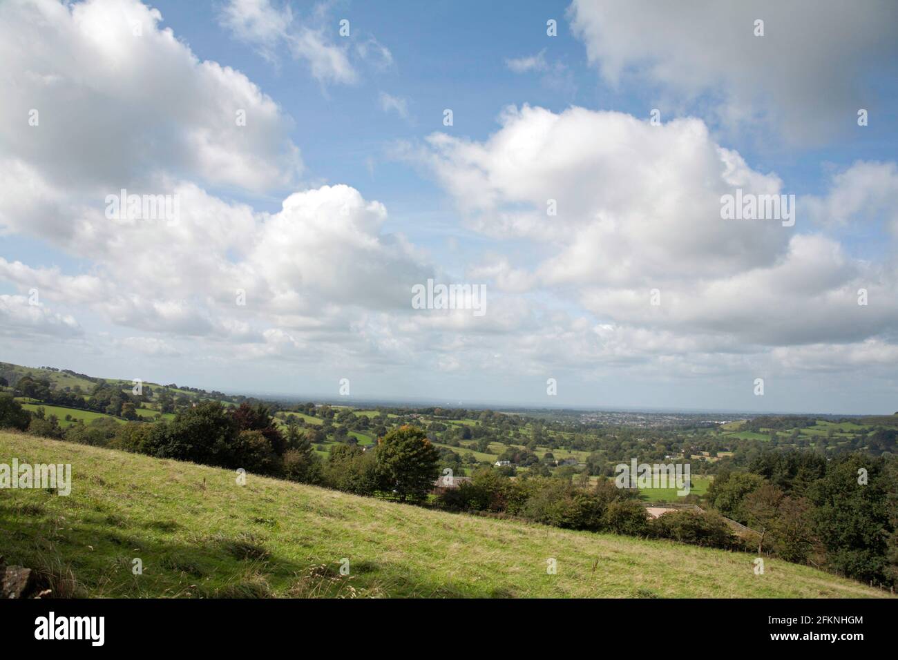 Cloud passing over fields near Macclesfield Cheshire England Stock Photo