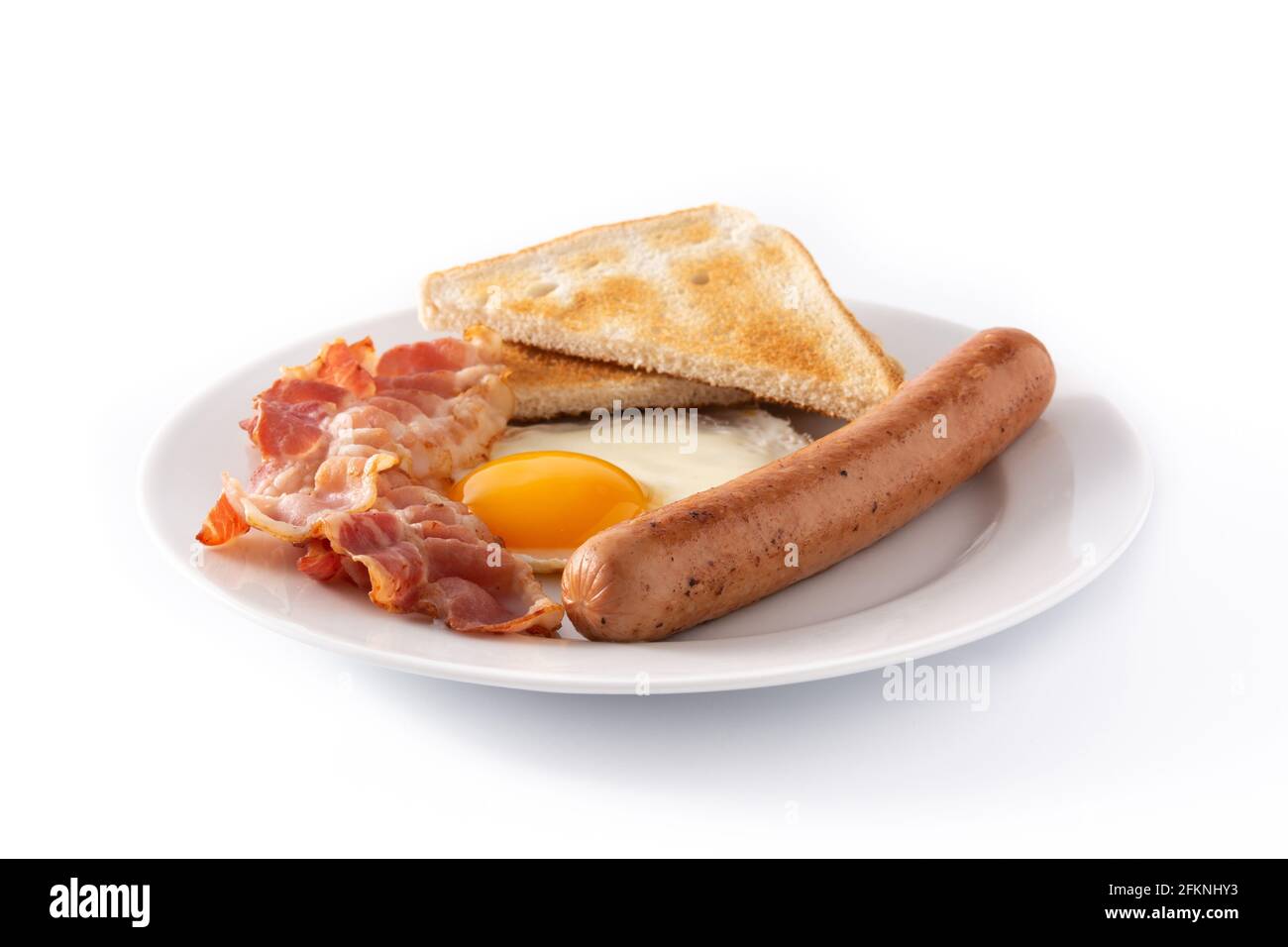 Traditional American breakfast with fried egg,toast,bacon and sausage isolated on white background Stock Photo