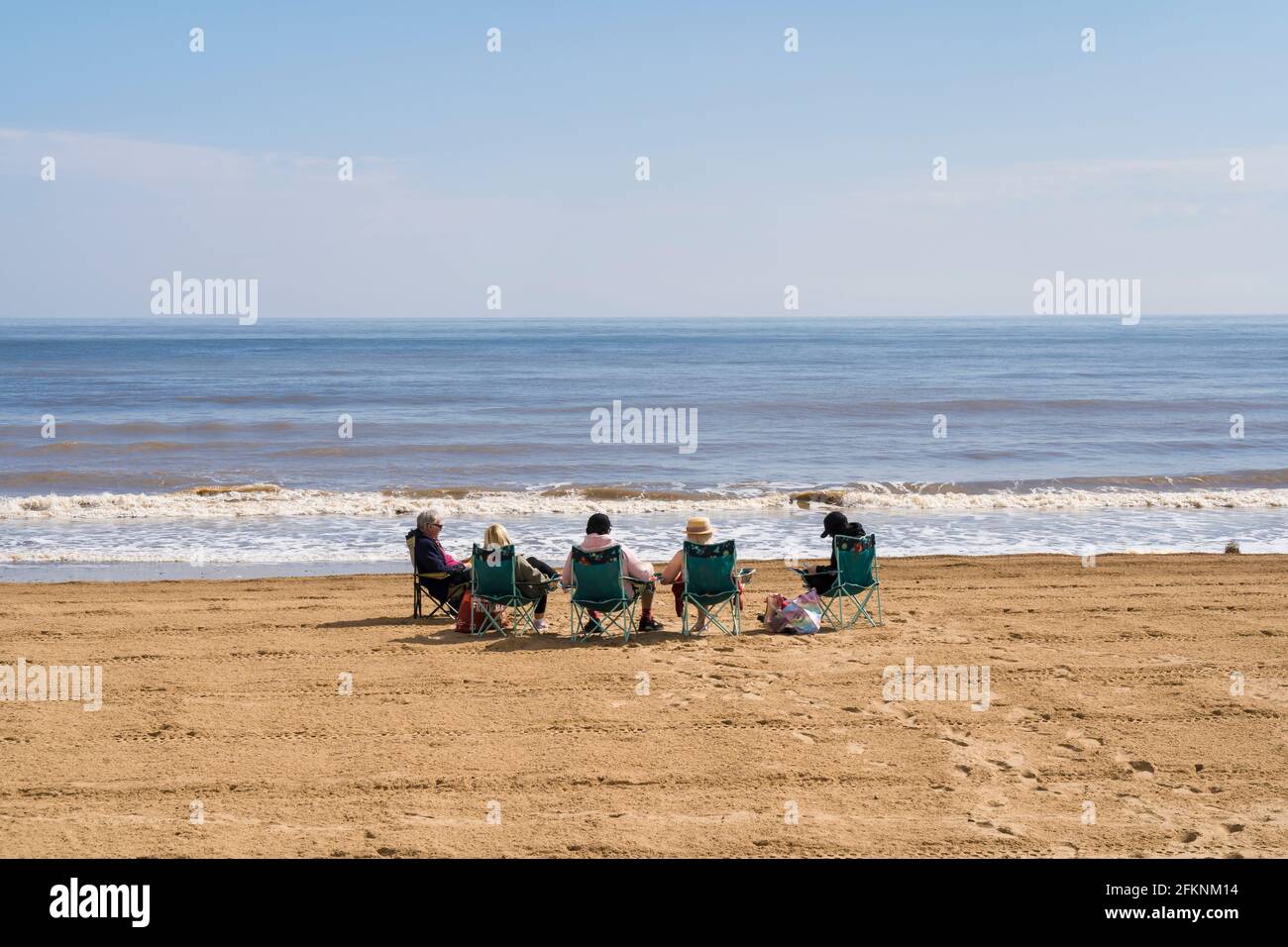 Family enjoying day out on Mablethorpe beach Lincolnshire Stock Photo