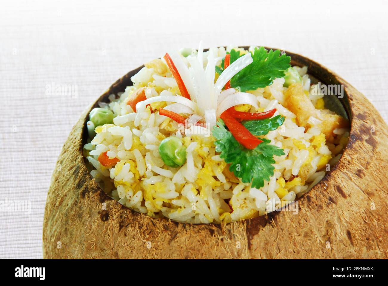 Fried rice in coconut shell Stock Photo