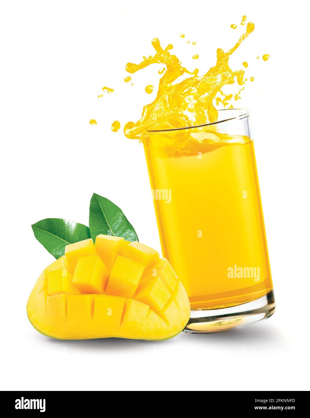 Mango juice splash out of glass with mango fruit on white background Stock Photo