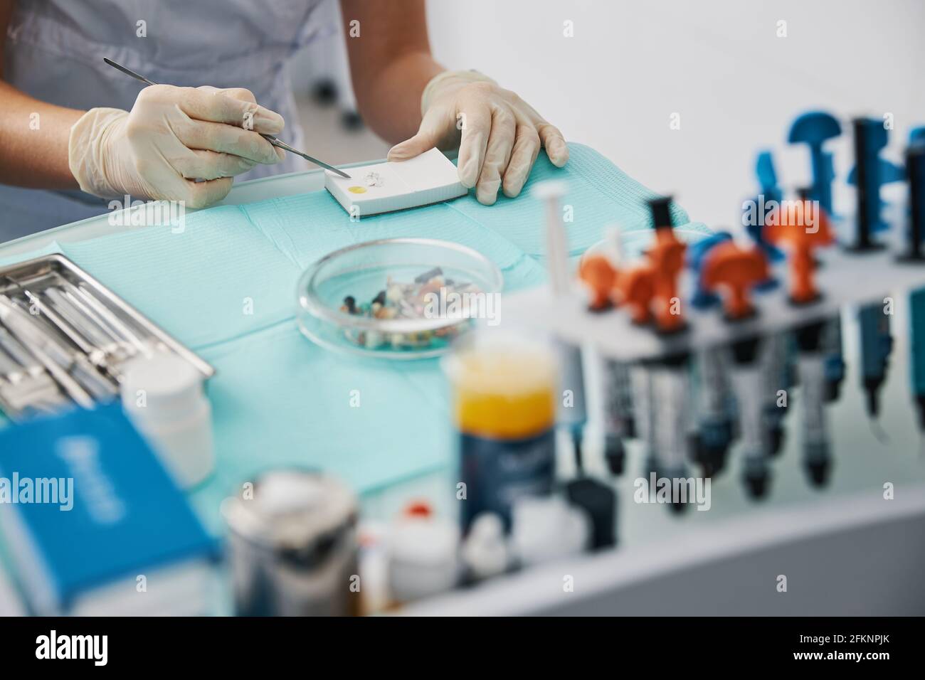 Production of tooth filling from dental cement Stock Photo Alamy