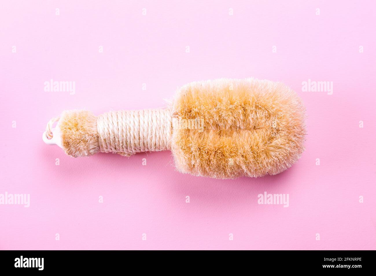 Spa beauty products with palm fiber dry body brush for scrubbing, peeling and massage. Beauty blogger, spa and wellness center concept. Top view, clos Stock Photo