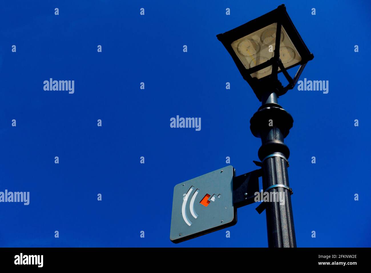 street lamp with a symbol for wireless internet Stock Photo