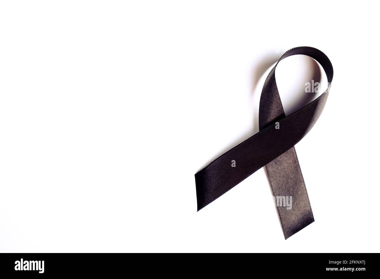 Black ribbon - sign of POW/MIA remembrance and mourning, melanoma awareness, sleep disorders and gang prevention symbol. Isolated on white background, Stock Photo