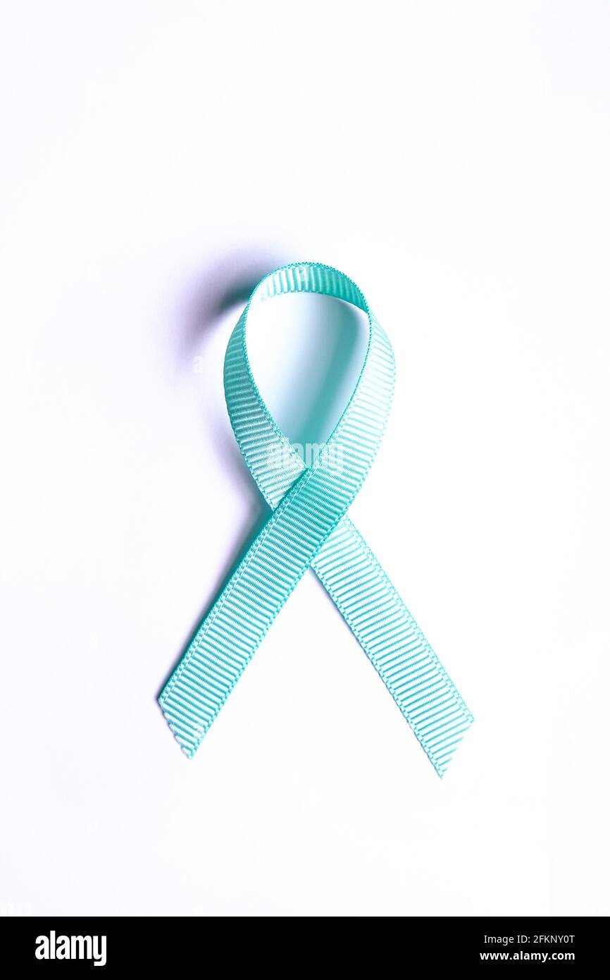 Blue awareness ribbon - symbol for fighting prostate cancer, support the  survivors and child abuse awareness. Isolated on white background, copy  space Stock Photo - Alamy