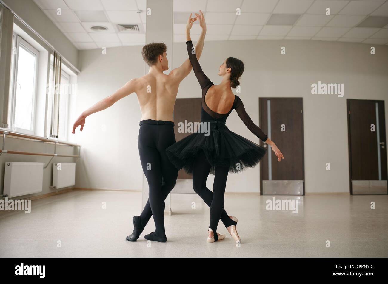 Female and male ballet dancers, dancing in action Stock Photo