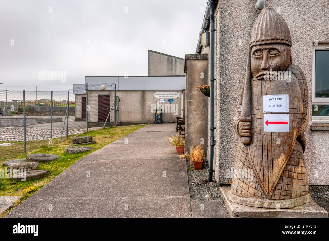 Sign for polling station at Uig during 2014 Scottish independence referendum is taped to a giant model beserker chess piece from the Lewis chess set. Stock Photo