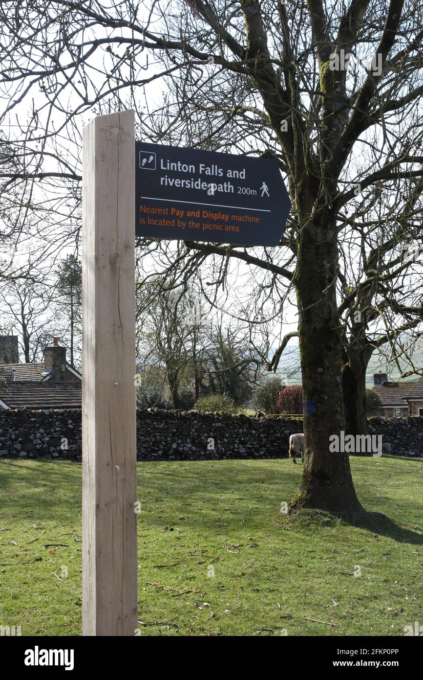 Wooden Signpost to Linton Falls in Grassington Car Park on the Dales