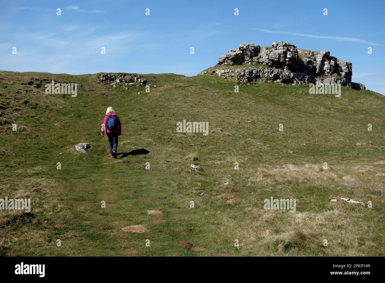 Woman Walking by Conistone Pie Between Kettlewell & Grassington on the Dales Way Long Distance Footpath in the Yorkshire Dales National Park, England. Stock Photo