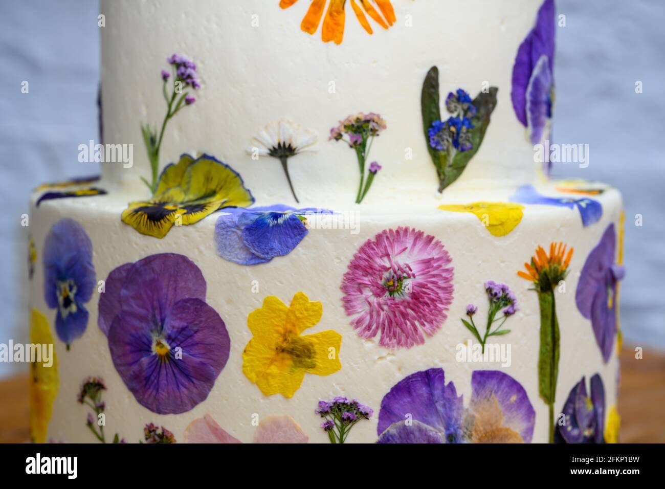 Wedding cake with pressed flower design Stock Photo