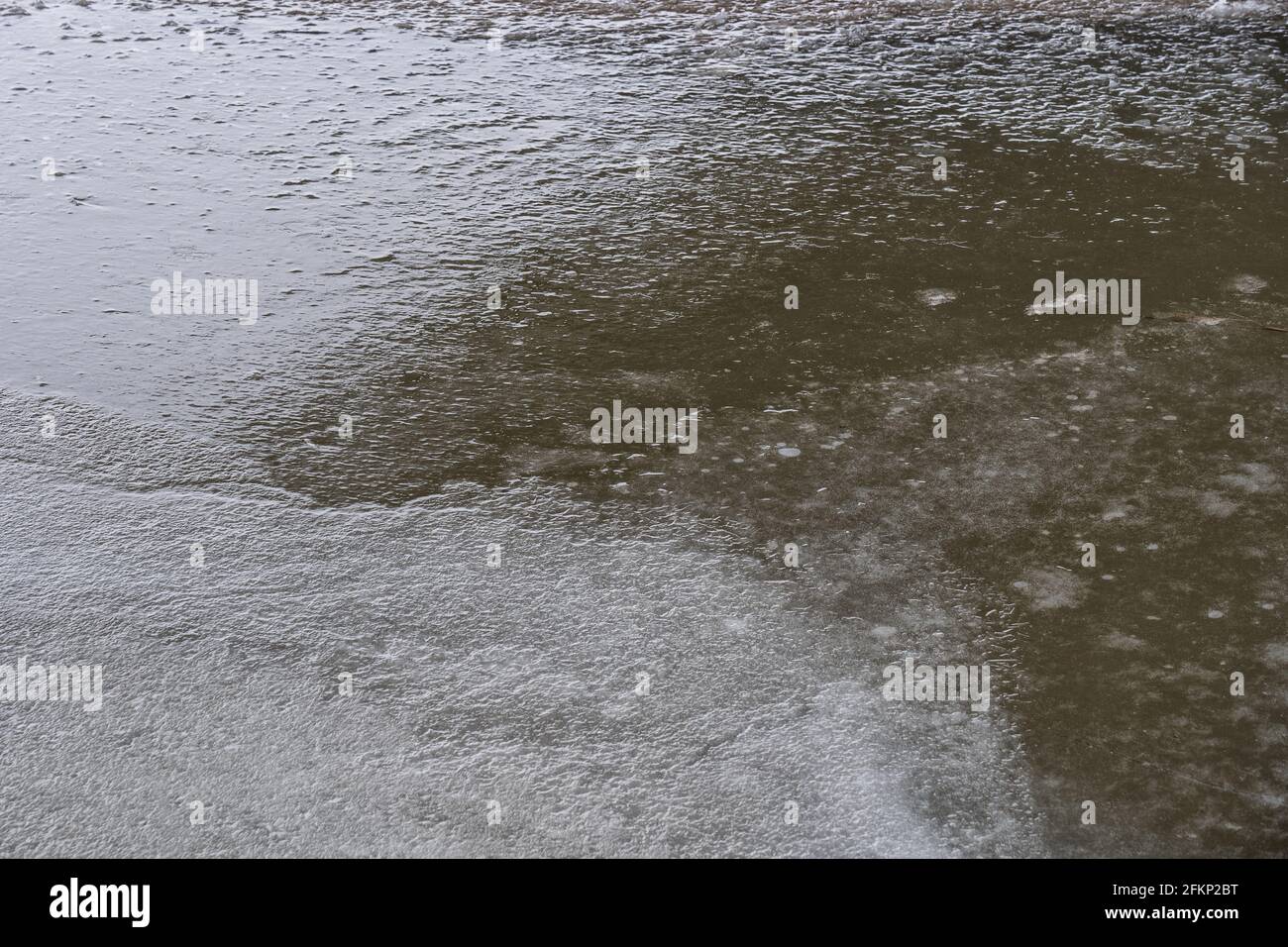 Frozen ice surface abstract background, river in winter. Stock Photo