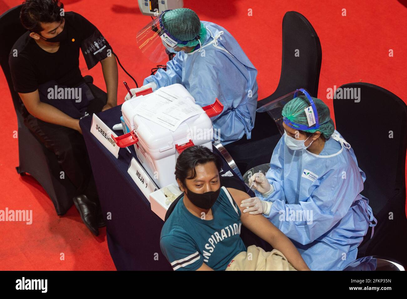 Jakarta, Indonesia. 3rd May, 2021. People get inoculated with COVID-19 vaccines in Jakarta, Indonesia, May 3, 2021. Credit: Veri Sanovri/Xinhua/Alamy Live News Stock Photo