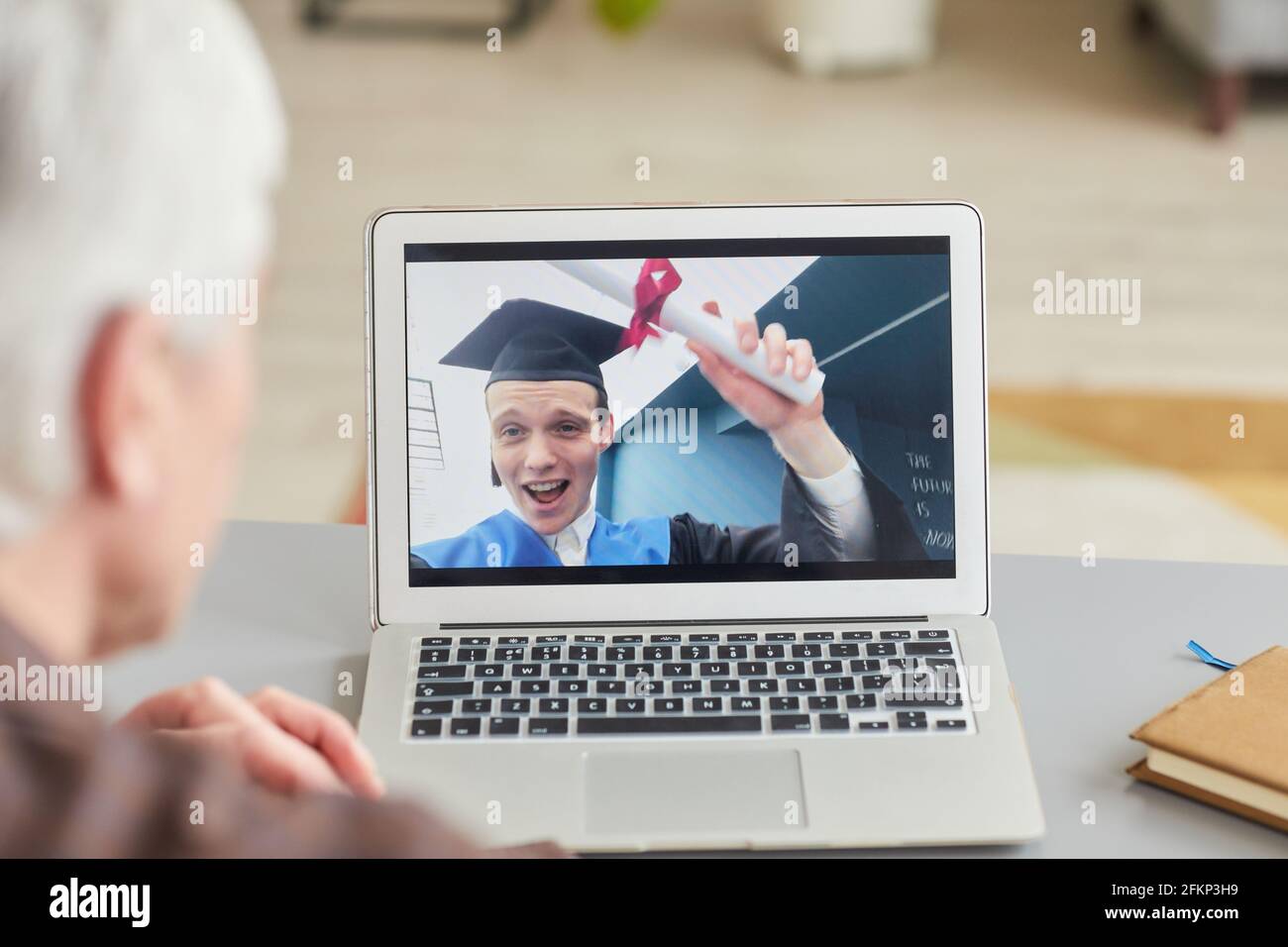 Teenage student graduation hat holding hi-res stock photography and ...