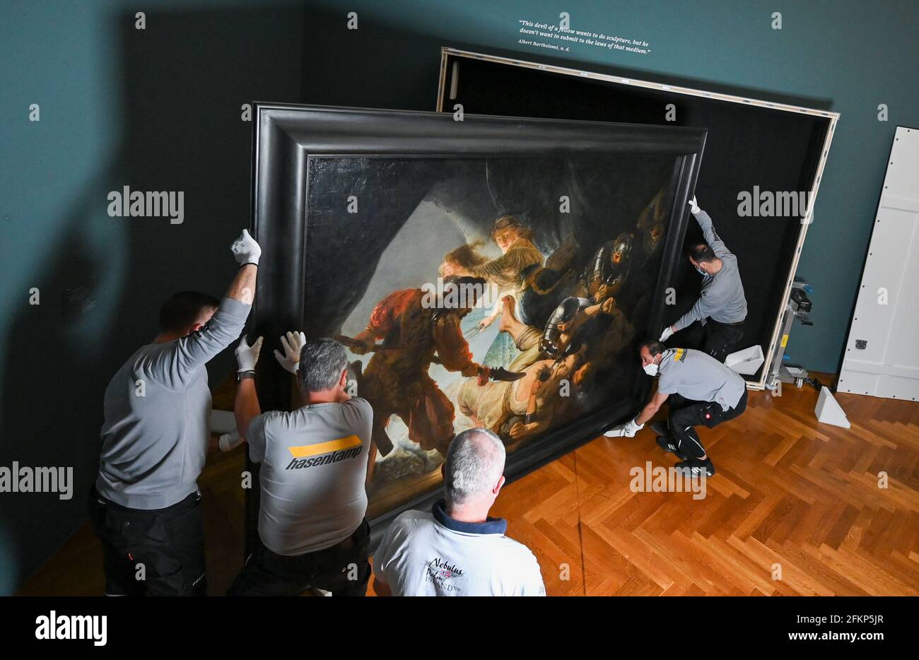 03 May 2021, Hessen, Frankfurt/Main: Employees of the international freight forwarder Hasenkamp pack the painting "The Blinding of Simson (1636)" by the Dutch master Rembrandt von Rijn (1606-1669) in the Städel Art Museum into a special crate. Five months before the start of the major Rembrandt exhibition at the Städel Museum, one of the main works will travel from Frankfurt to Canada. The two-by-three-meter painting will be on display in the exhibition "Rembrandt in Amsterdam. Creativity and Competition" at the National Gallery Ottawa (Canada). (to dpa "Giant Rembrandt goes on tour") Photo: A Stock Photo