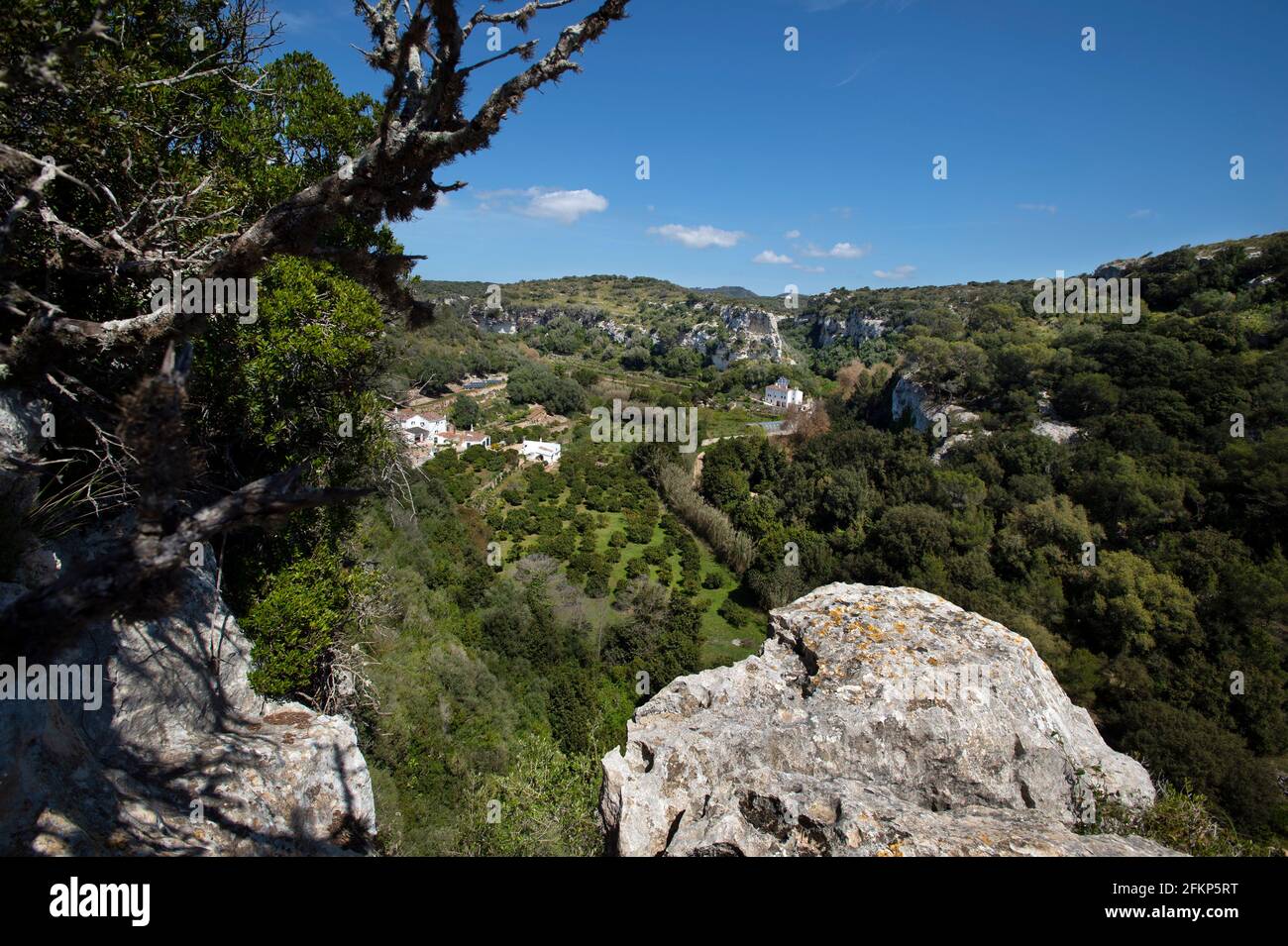 Looking down on a farmstead in the immense barranc d'Algendar on menorca spain Stock Photo