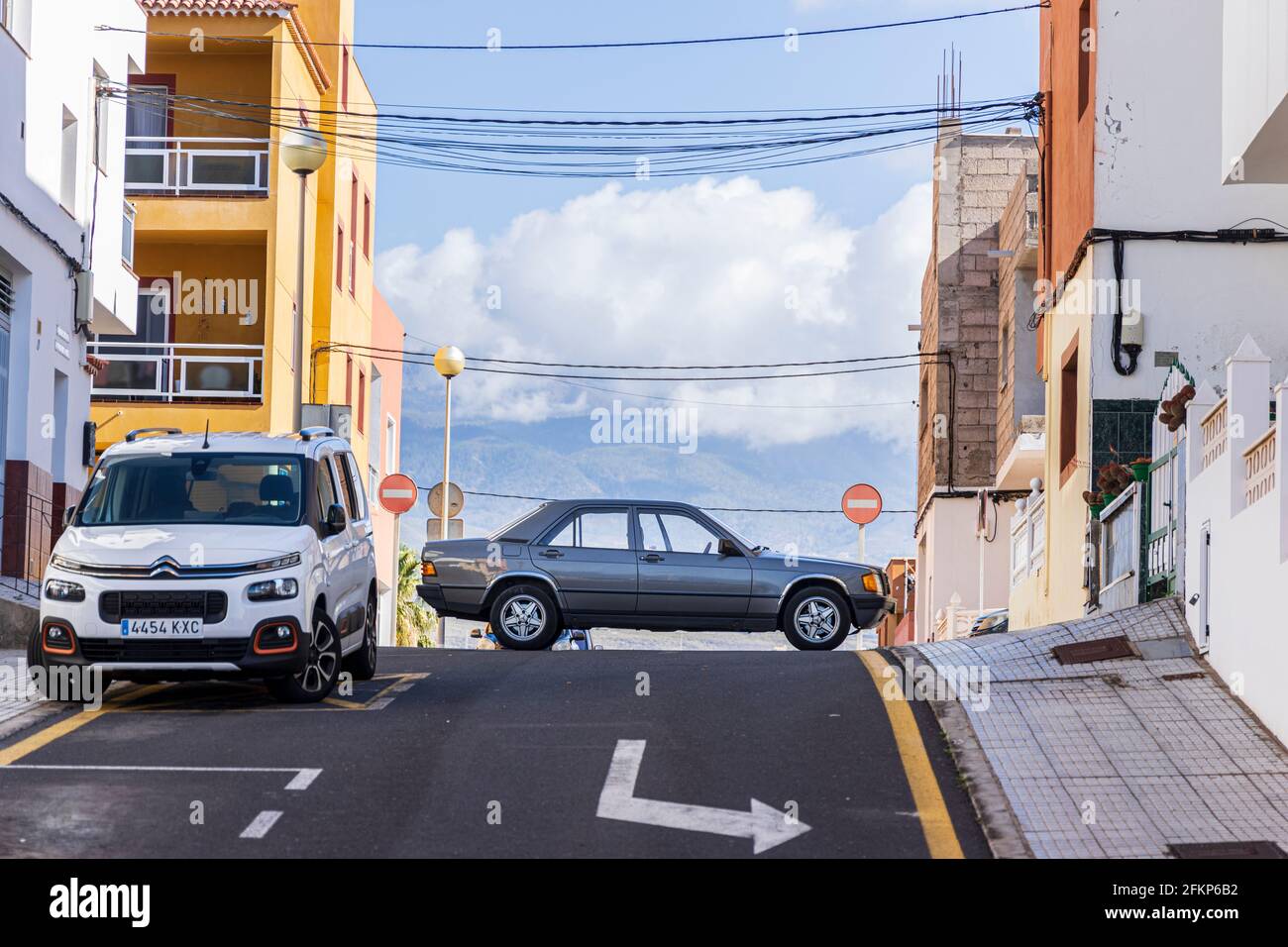 Empty Mercedes Benz car parked across a road junction in Los Abrigos, Tenerife, Canary Islands, Spain Stock Photo
