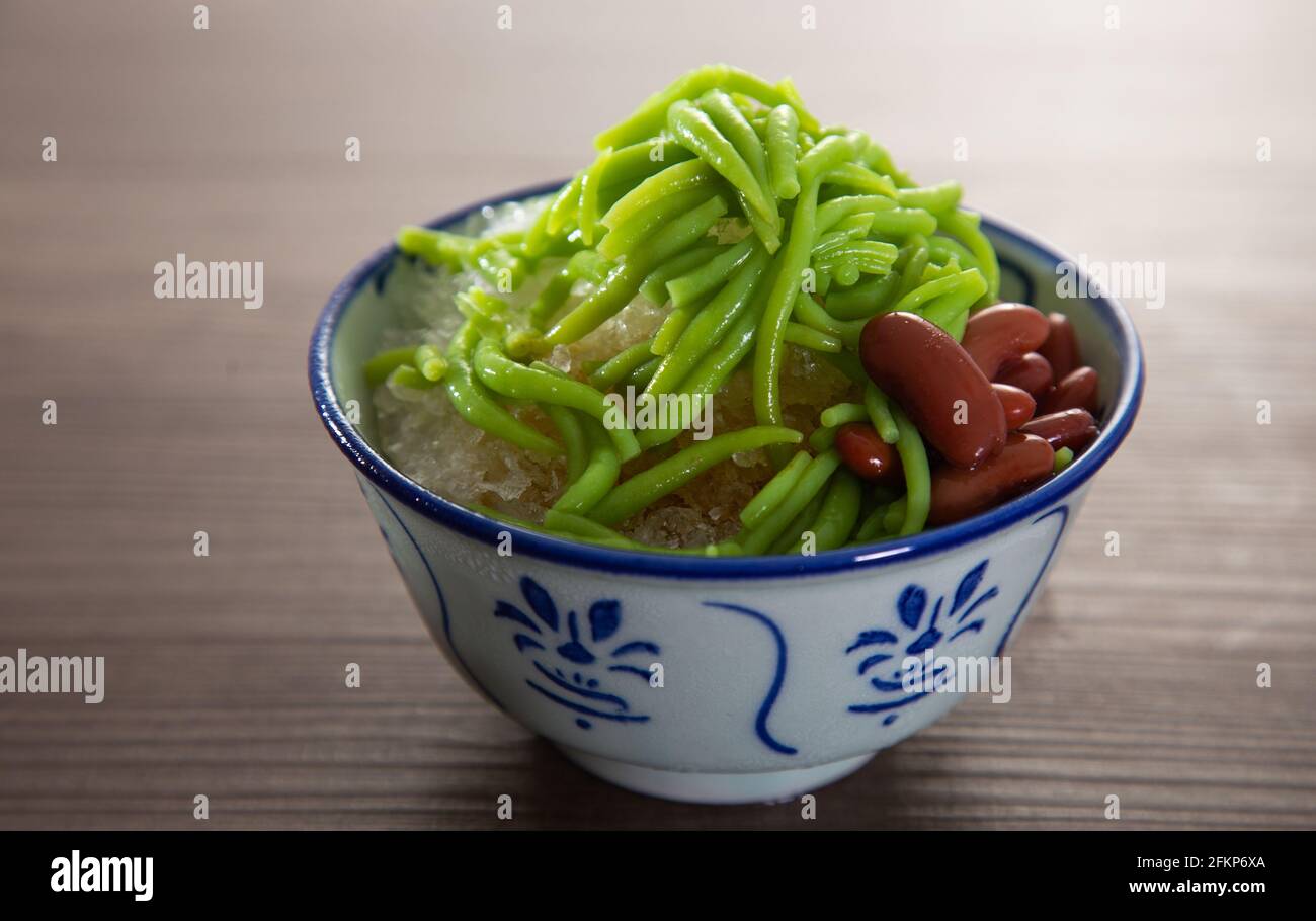 Malaysian desserts called Cendol .Cendol is made from crushed ice cubes and a variety of sweets and fruits. Stock Photo