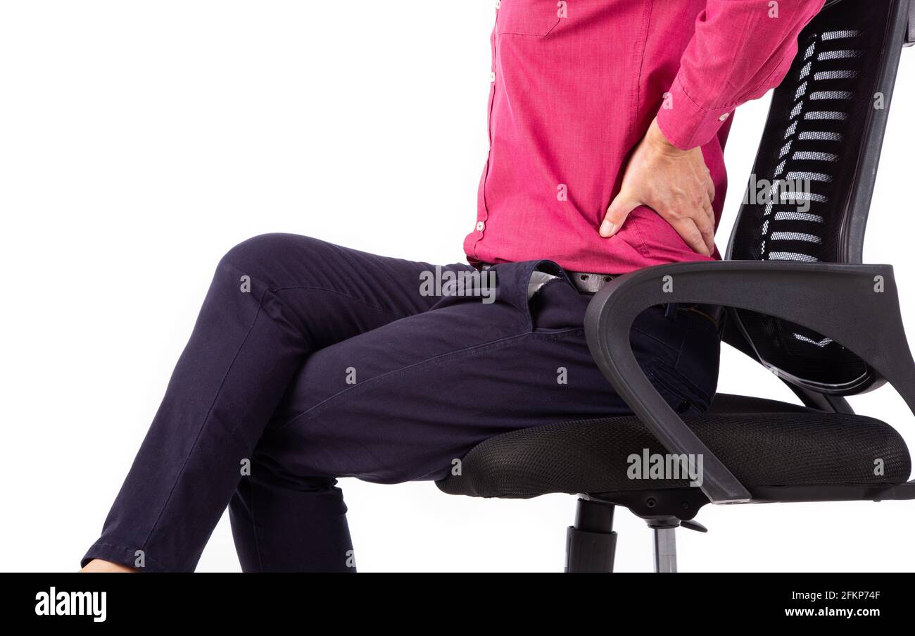 Business man with back pain sitting in an office chair. Pain relief