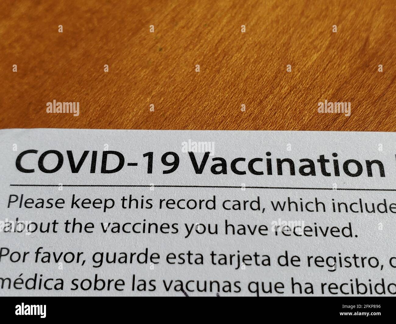 Close-up shot of the Covid-19 vaccination card with notices in English and Spanish in Lafayette, California, March 27, 2021. () Stock Photo