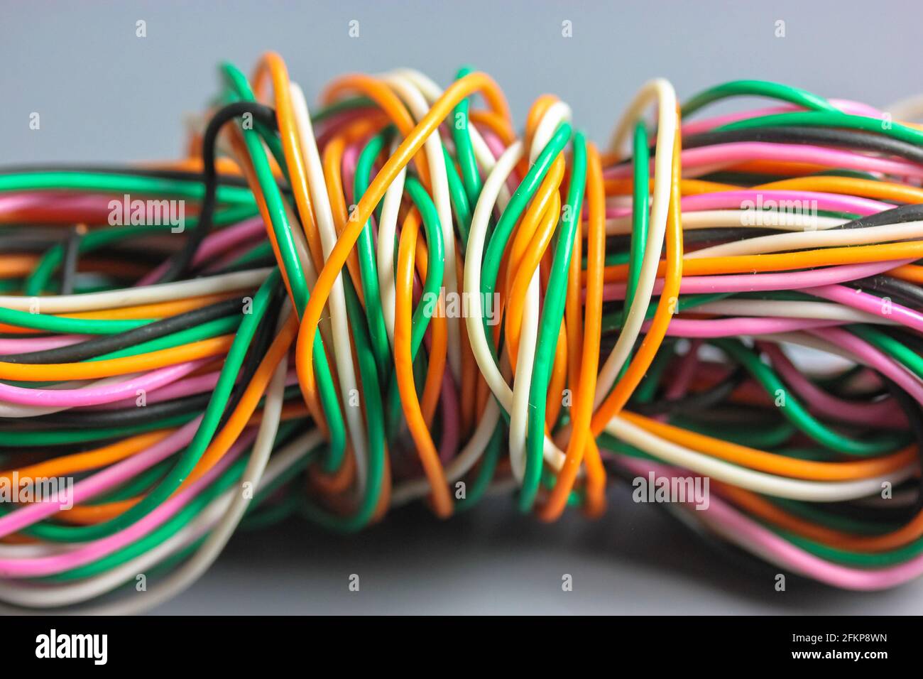 A bundle of multicolored electrical, car, computer, telephone wires