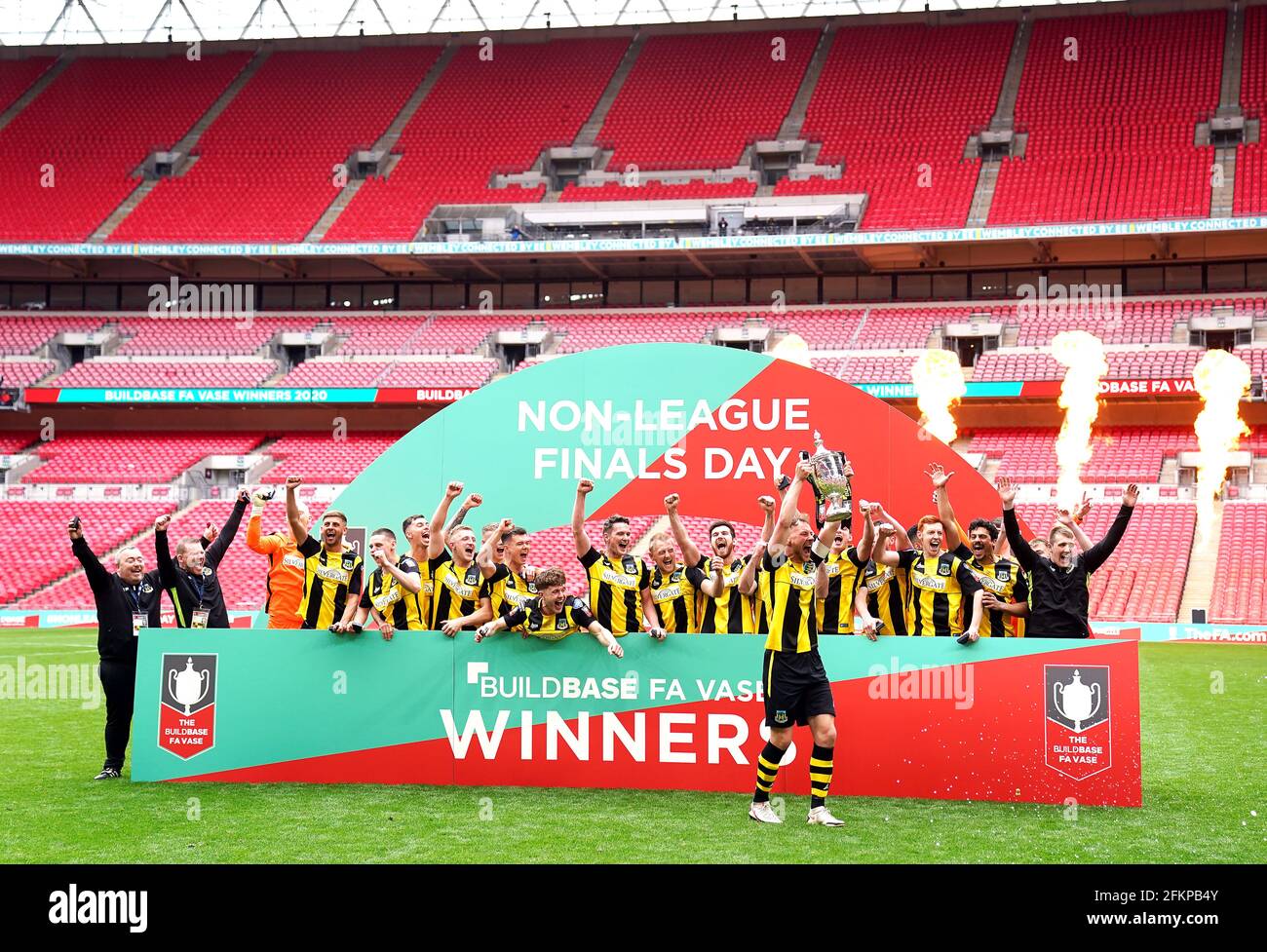 Hebburn Town's Louis Storey celebrates with team-mates and staff with the  Buildbase FA Vase 2019/20 Trophy after victory in the Final at Wembley  Stadium, London. Picture date: Monday May 3, 2021 Stock