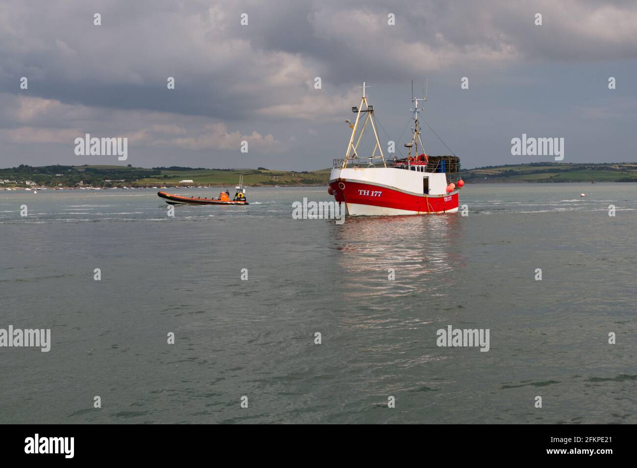 A fishing boat returning to Padstow along the Camel Estuary in Cornwall Stock Photo
