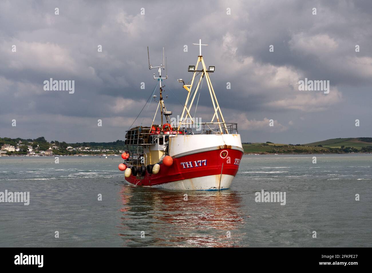 A fishing boat returning to Padstow along the Camel Estuary in Cornwall Stock Photo
