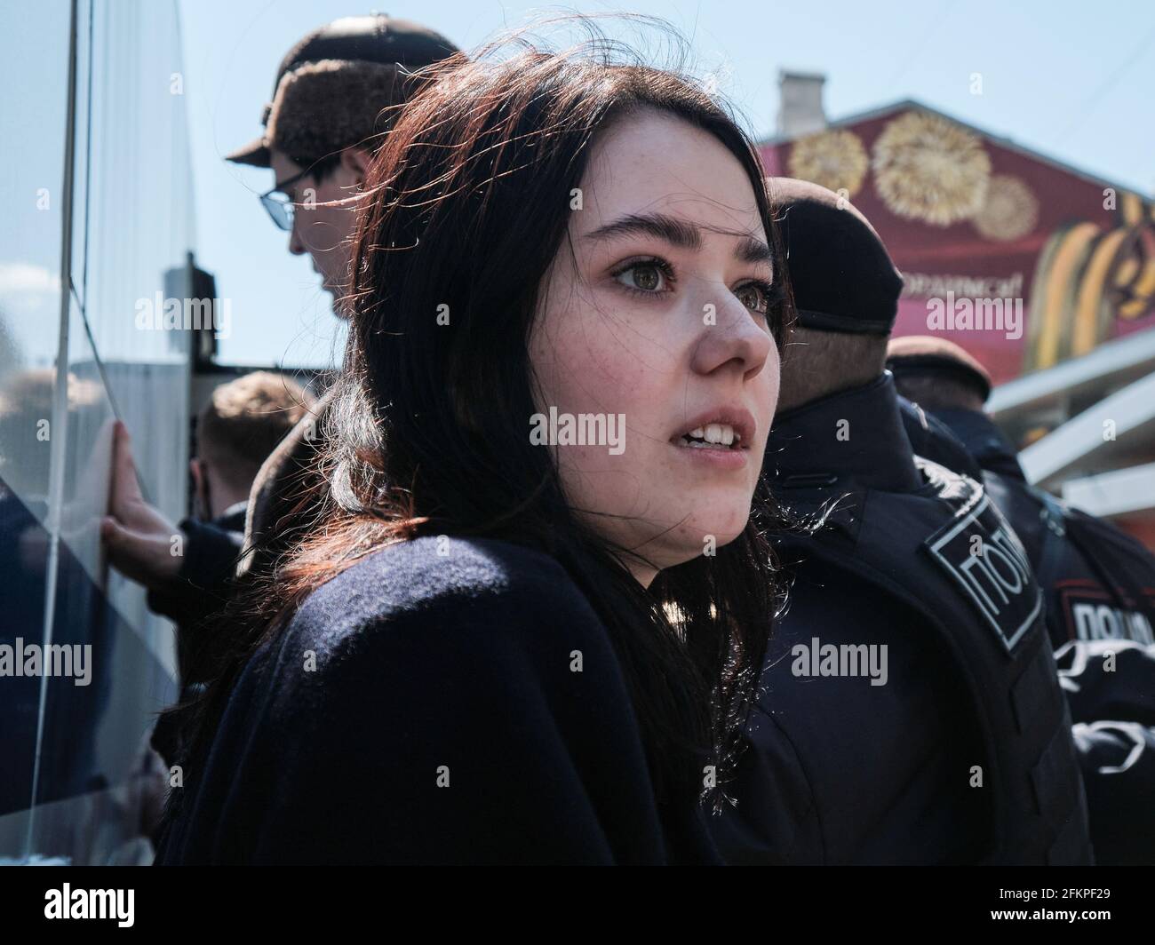 Worried girl during the detention of the Communists near the paddy wagon. Day of International Workers' Solidarity 1 May. Meeting of the Communist Party deputies with supporters in the Novopushkinsky square. (Photo by Mihail Siergiejevicz / SOPA Imag/Sipa USA) Stock Photo