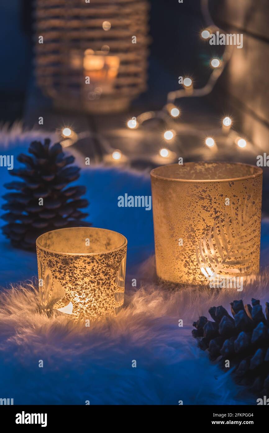 Candle making tealights, these small blue tealight candles are in liquid  form on a candlemaker's bench. White wicks are in the liquid wax cups Stock  Photo - Alamy