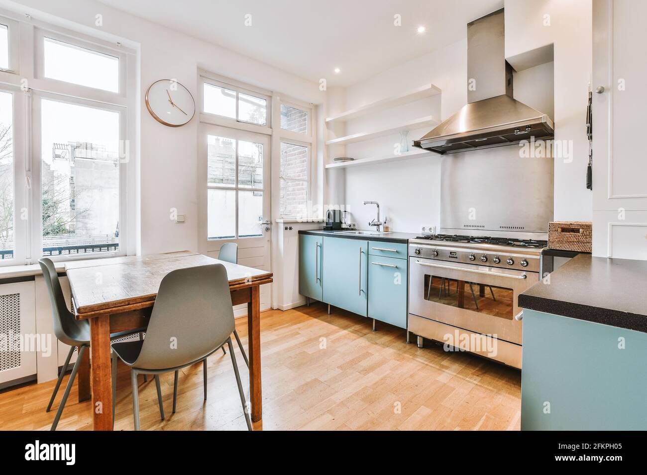 Light kitchen with modern furniture Stock Photo - Alamy