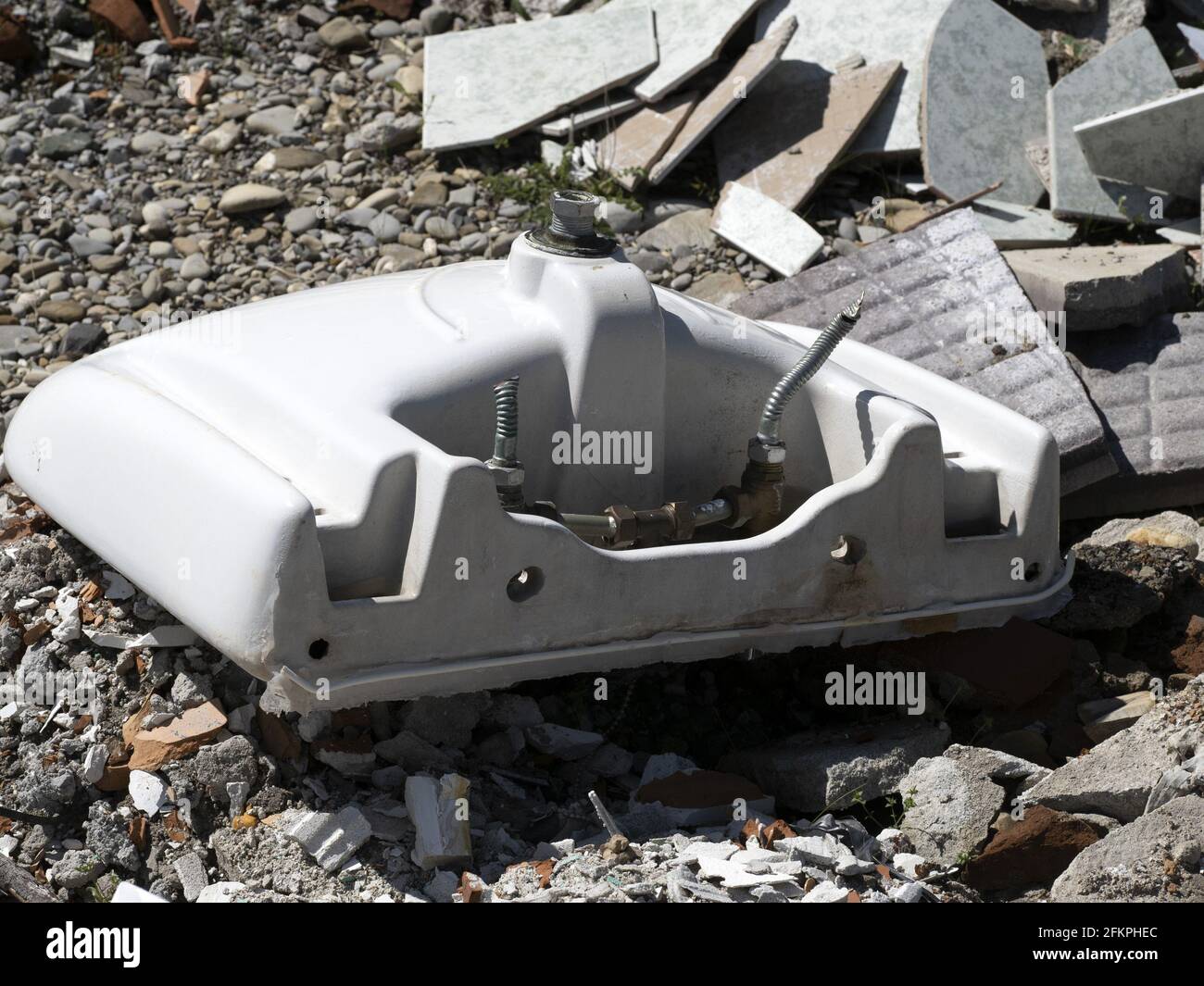 abandoned broken toilet in a field Stock Photo