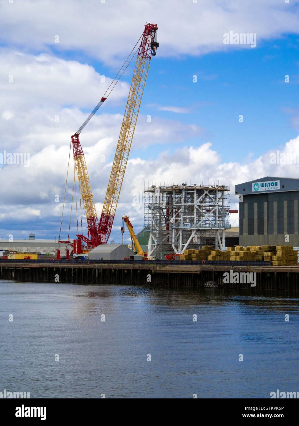 Large; mobile crane; mobile; crane; quayside; Wilton Group; Wilton; group; fabrication; yard; manufacture; manufacturing; white, subsea, structure, co Stock Photo